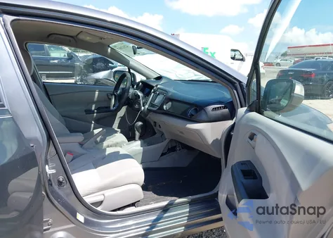 2011 Honda Insight Ex from USA, damaged, VIN JHMZE2H70BS008854